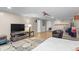 Finished basement with entertainment center, home theater projector, and hardwood floors at 690 W 1St Ave, Broomfield, CO 80020