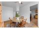 Dining area with hardwood floors, natural light, and an open view to the kitchen at 690 W 1St Ave, Broomfield, CO 80020