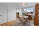 Cozy dining area featuring a round table, ceiling fan, and window views at 690 W 1St Ave, Broomfield, CO 80020