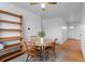 Bright dining space featuring hardwood floors, a ceiling fan, and natural light at 690 W 1St Ave, Broomfield, CO 80020