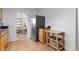 Charming kitchen featuring stainless steel refrigerator and tiled flooring at 690 W 1St Ave, Broomfield, CO 80020