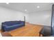 Inviting living room with hardwood floors, recessed lights, and a view to another room at 690 W 1St Ave, Broomfield, CO 80020