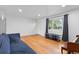 Bright living room featuring hardwood floors, large window, and neutral wall color at 690 W 1St Ave, Broomfield, CO 80020