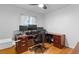 Bright office space with three monitors, hardwood floors, and natural light at 690 W 1St Ave, Broomfield, CO 80020