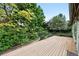 Outdoor deck surrounded by lush greenery and landscaping at 2130 Chestnut Cir, Erie, CO 80516