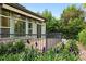 Back deck features flowers, green siding, and lush greenery at 2130 Chestnut Cir, Erie, CO 80516