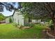 Charming backyard featuring a landscaped garden and a well-maintained lawn surrounding the house at 2130 Chestnut Cir, Erie, CO 80516