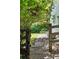 Stone pathway with decorative gate leads into lush backyard and garden at 2130 Chestnut Cir, Erie, CO 80516
