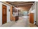 Unfinished basement featuring exposed ceilings, concrete floors, and a utility sink at 2130 Chestnut Cir, Erie, CO 80516