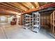 Unfinished basement space with visible ceiling joists, concrete floor, and ample room for storage and customization at 2130 Chestnut Cir, Erie, CO 80516