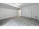 Neutral finished basement features double closet, open door, and space for activities at 2130 Chestnut Cir, Erie, CO 80516