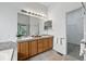 Bathroom boasts a dual sink vanity with a large mirror, providing ample space for getting ready at 2130 Chestnut Cir, Erie, CO 80516