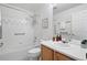 Bathroom featuring a tub and shower, wood vanity, and medicine cabinet over the toilet at 2130 Chestnut Cir, Erie, CO 80516