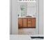 Bright bathroom featuring a double vanity with wood cabinets and tile floors at 2130 Chestnut Cir, Erie, CO 80516