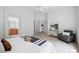 Bright bedroom featuring a seating area, and multiple entries at 2130 Chestnut Cir, Erie, CO 80516