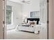 Bright bedroom features large window, ceiling fan and neutral colors at 2130 Chestnut Cir, Erie, CO 80516