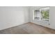 Empty bedroom with a window overlooking the porch at 2130 Chestnut Cir, Erie, CO 80516