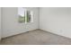 Bright bedroom with neutral carpet and a window at 2130 Chestnut Cir, Erie, CO 80516