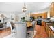 Open concept dining area with kitchen and living spaces at 2130 Chestnut Cir, Erie, CO 80516