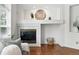 Close-up of the fireplace with a decorative mantel and tile surround at 2130 Chestnut Cir, Erie, CO 80516