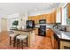 Well-equipped kitchen featuring oak cabinets, granite countertops, and stainless steel appliances at 2130 Chestnut Cir, Erie, CO 80516