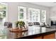 Bright living room with large windows and a fireplace at 2130 Chestnut Cir, Erie, CO 80516
