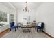 Bright living room with vaulted ceiling, large window, hardwood floors, and elegant decor at 2130 Chestnut Cir, Erie, CO 80516