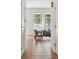 Bright living room showcasing neutral furniture, large windows, and tile flooring at 2130 Chestnut Cir, Erie, CO 80516