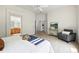 Bright main bedroom features a neutral color palette, comfortable furnishings, and an ensuite bathroom for added privacy at 2130 Chestnut Cir, Erie, CO 80516