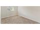 A carpeted bedroom with a window to let in natural light at 1488 S Andes Way, Aurora, CO 80017