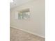 A bright bedroom with a large window and neutral carpeting at 1488 S Andes Way, Aurora, CO 80017