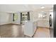 Open concept kitchen with a center island, granite countertops, and access to the backyard deck at 1488 S Andes Way, Aurora, CO 80017