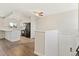 Modern kitchen with white cabinetry, hardwood flooring, and black appliances, offering a clean aesthetic at 1488 S Andes Way, Aurora, CO 80017