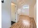 Bright room featuring hardwood floors, dormer windows, and recessed lighting at 1525 Roslyn St, Denver, CO 80220