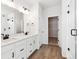 Double vanity bathroom with modern fixtures and walk-in shower at 8588 Eagle River St, Littleton, CO 80125