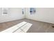 Bright and airy bedroom with plush carpeting and large windows at 8588 Eagle River St, Littleton, CO 80125
