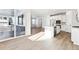 Sunlit kitchen with white cabinets and island at 8588 Eagle River St, Littleton, CO 80125