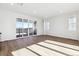 Open living room with sliding glass doors leading to a deck at 8588 Eagle River St, Littleton, CO 80125