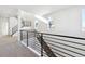 Upper hallway with carpet and modern railing at 8588 Eagle River St, Littleton, CO 80125