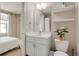 Stylish bathroom featuring a modern vanity, shelving, and adjacent bedroom at 2426 Welton St, Denver, CO 80205