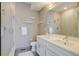 Modern bathroom features double sinks, glass shower, and floating shelves at 2426 Welton St, Denver, CO 80205