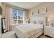 Bedroom boasting a large window with city views, plush decor, and a tranquil ambiance at 2426 Welton St, Denver, CO 80205