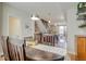 Inviting dining area featuring a rustic wooden table and stylish lighting, adjacent to the modern kitchen at 2426 Welton St, Denver, CO 80205