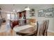 Dining room with dark wooden table, stylish decor and view of the modern kitchen area at 2426 Welton St, Denver, CO 80205