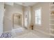 Bright foyer featuring wood floors, white walls, a decorative mirror and eye-catching rugs at 2426 Welton St, Denver, CO 80205