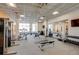 Well-lit gym featuring various exercise machines, weights, mirrors, and a carpeted floor at 2426 Welton St, Denver, CO 80205