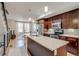 Modern kitchen features stainless steel appliances, white countertops and a functional island with a sink at 2426 Welton St, Denver, CO 80205