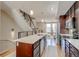 Bright, open kitchen with stainless appliances, an island, and modern finishes, flowing into the living area at 2426 Welton St, Denver, CO 80205