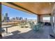 A spacious patio featuring a city skyline view with modern outdoor furniture and sleek design elements at 2426 Welton St, Denver, CO 80205