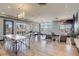 Large recreation room featuring a dining table, a ping pong table, living space, and city views at 2426 Welton St, Denver, CO 80205